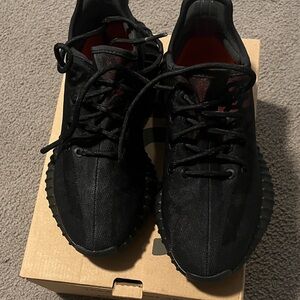 Yeezy Black and Red Athletic Shoes